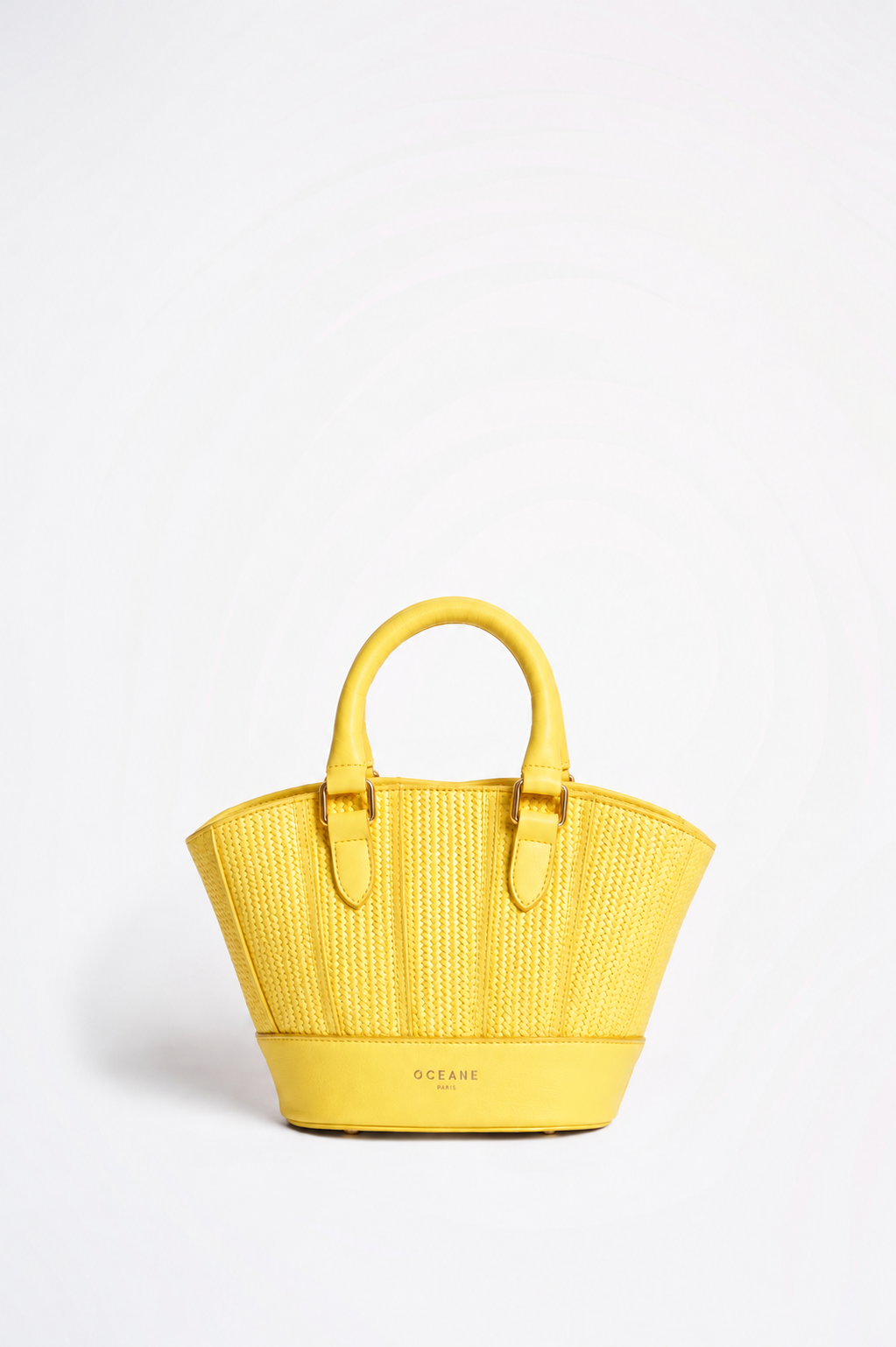 Jade Bag gialla di Oceane Paris, vista frontale con due manici e lavorazione intrecciata.