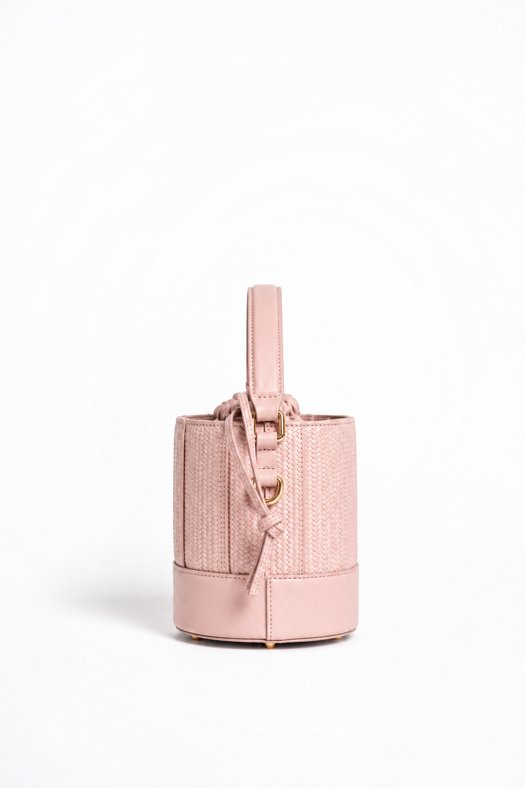 Grace Bucket rosa cipria di Oceane Paris, vista laterale con attacco del manico, dettaglio dorato e cordoncino di chiusura.